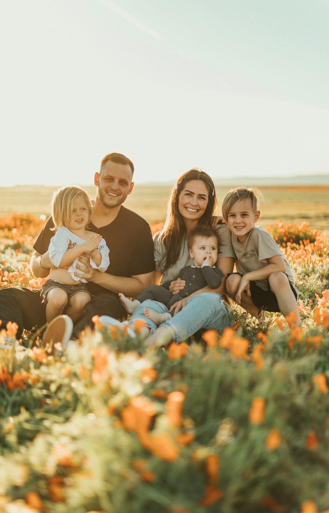 A family laughing together during a portrait session